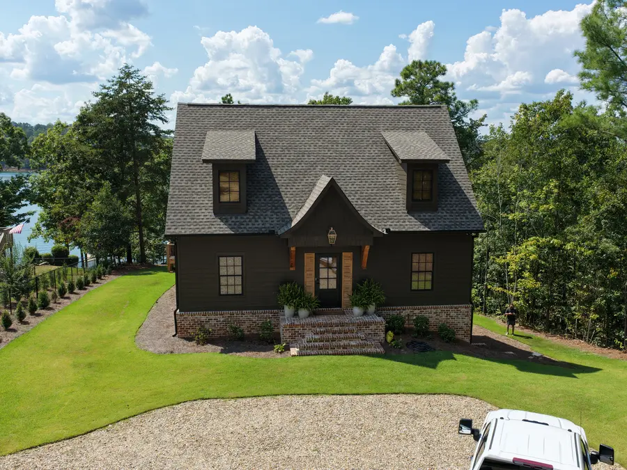 Aerial view of a completed custom home and landscaping by Still Oak Homes