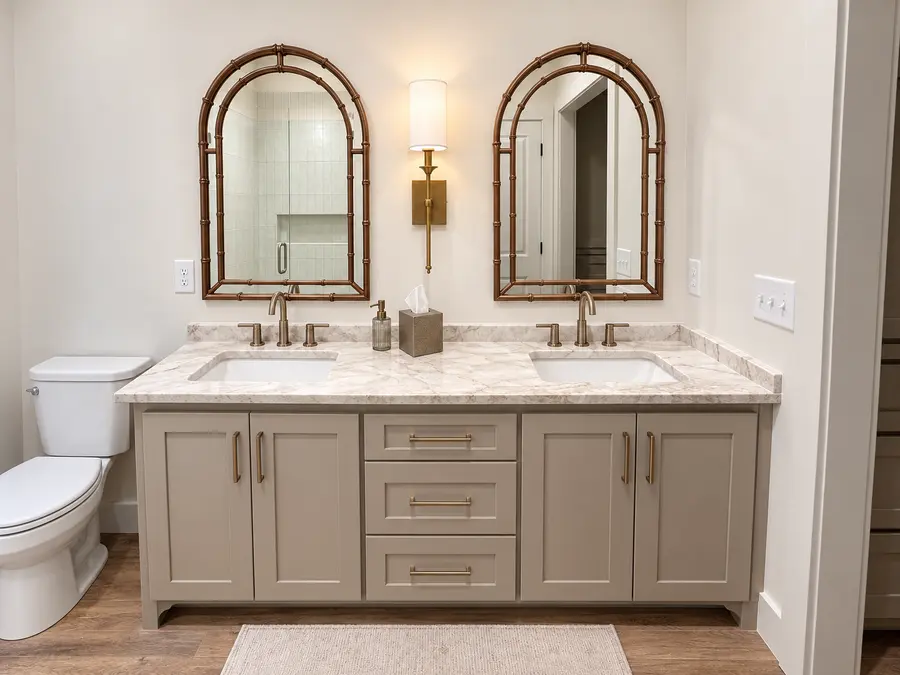 Double vanity bathroom with arched mirrors in a Still Oak custom home