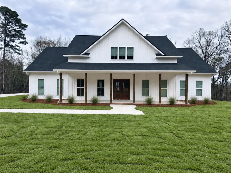 Modern farmhouse with front porch built by Still Oak Homes in Alabama